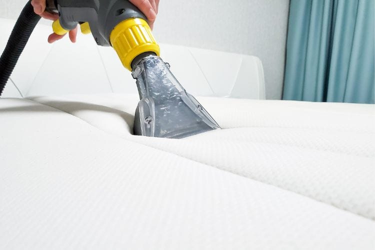 Vacuuming a mattress