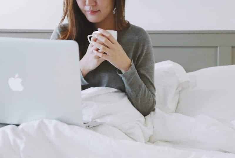 Woman working comfortably on an adjustable bed mattress